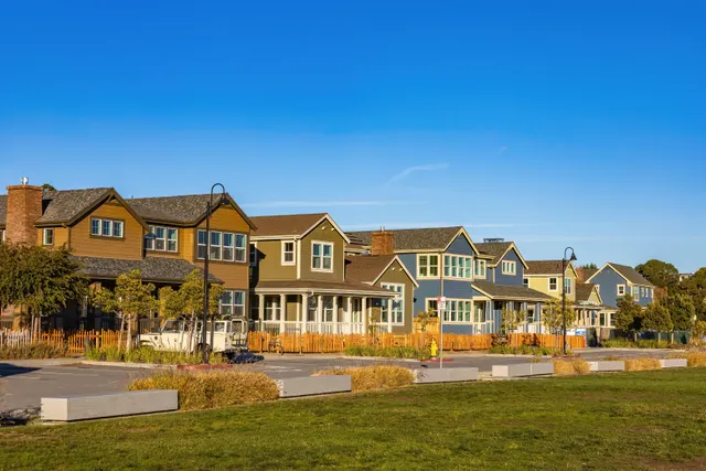 Suburban homes along a landscaped residential street.